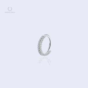 Variations de piercing tragus Cosmica, designs uniques et modernes