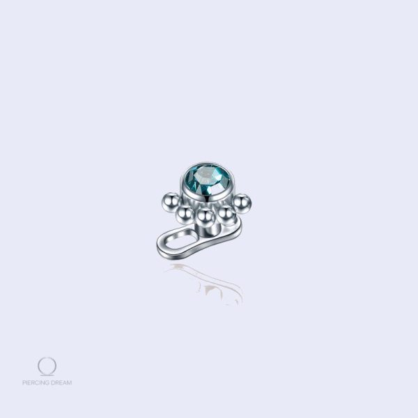 piercing-corps-zircon-bleu-1 Piercing corps Unitya Saphir avec zircon bleu