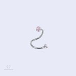 Piercing argenté pour lèvre, design Torsada avec pierres roses