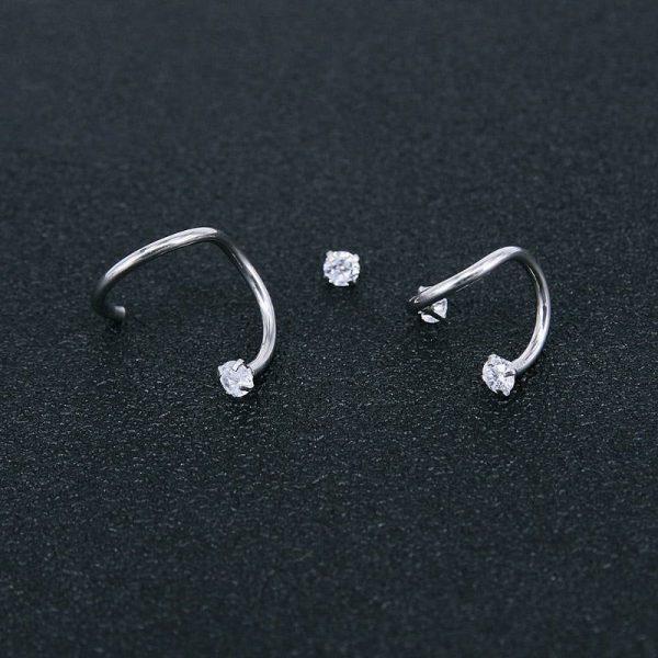 Piercing rook avec design torsadé et deux diamants