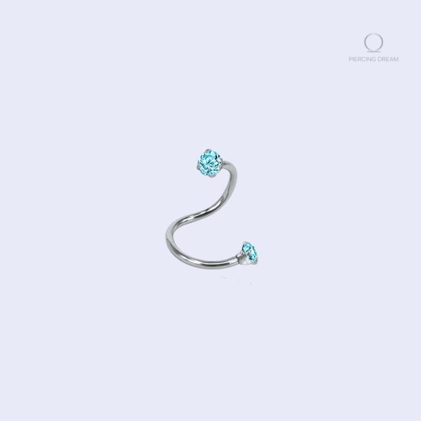 piercing-tragus-courbee-diamants-bleu-1 Piercing tragus courbé Torsada Ciel avec diamants bleus