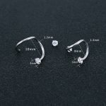 Piercing tragus orné de diamants bleus pour un style unique